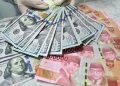 Rupiah Bergerak Fluktuatif, Tekanan Dolar AS Masih Membayangi